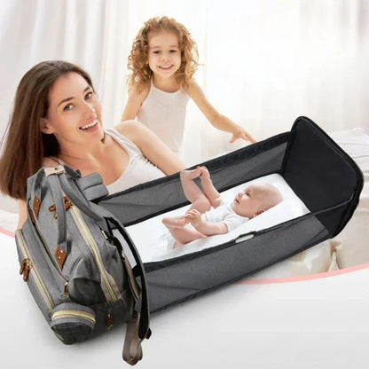 Mochila para mamá con cuna plegable