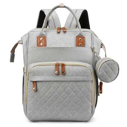 Mochila para mamá con cuna plegable